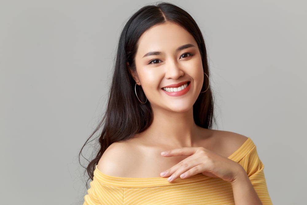 young happy attractive woman wearing yellow